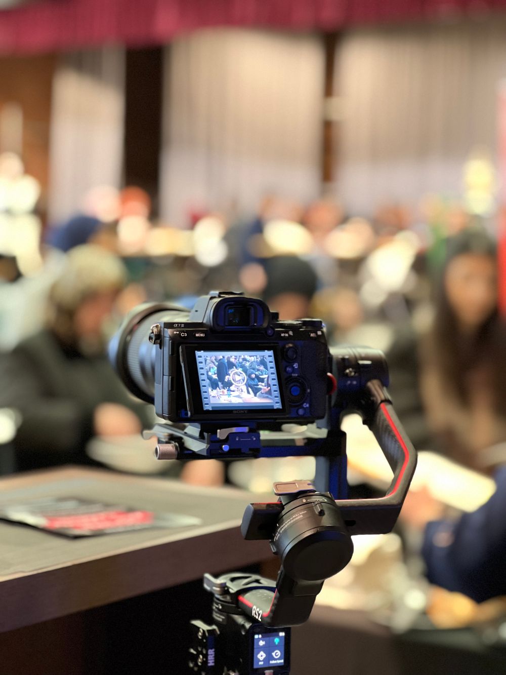Camera on a stabilizer recording a conference