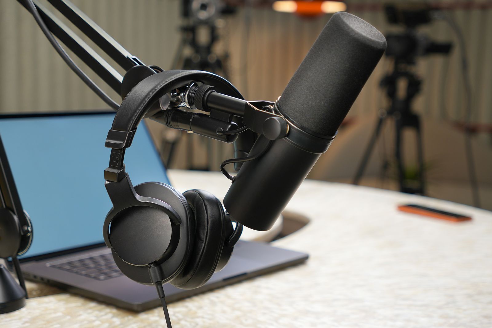 A microphone and headphones ready for a recorded conversation